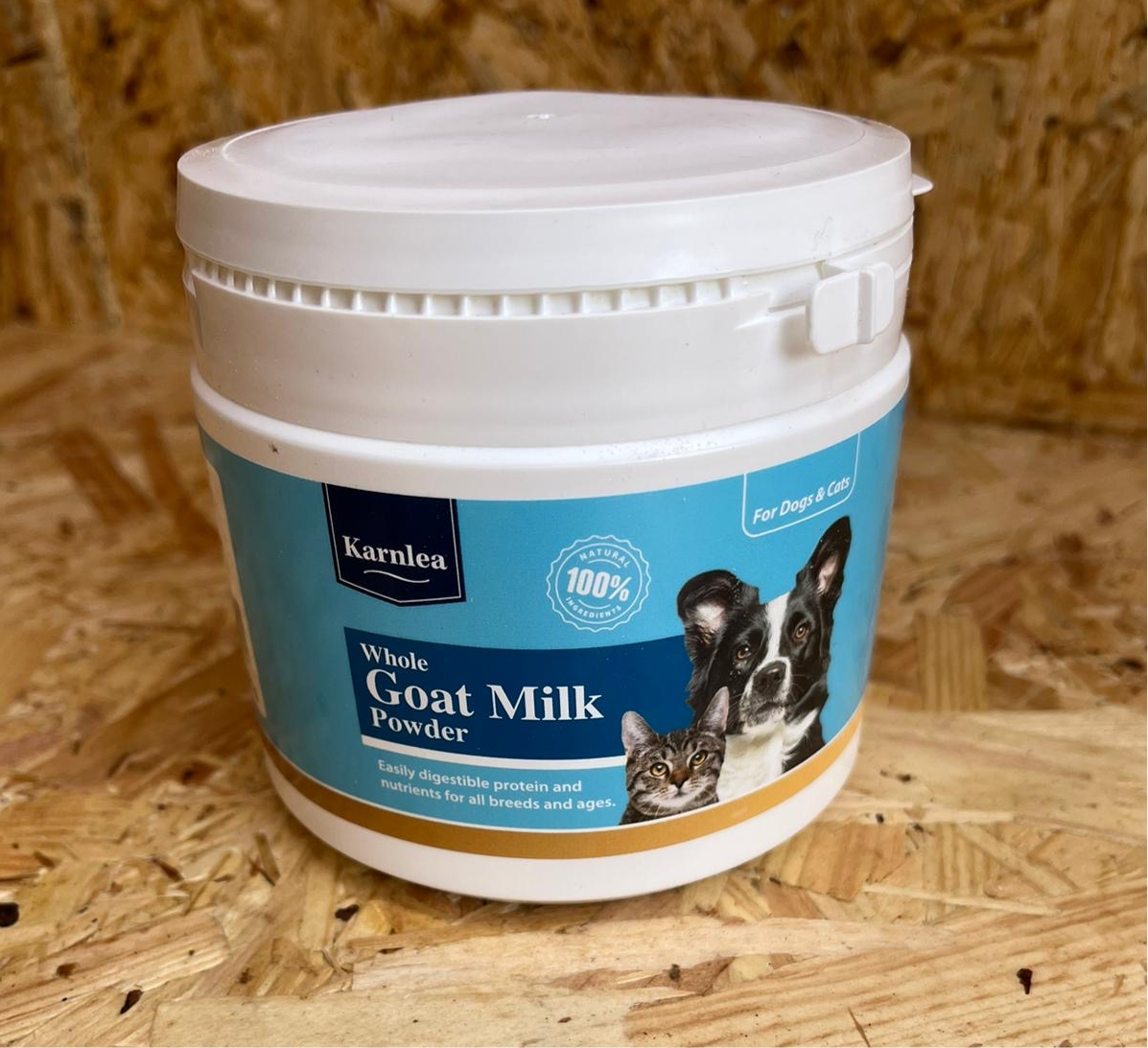 A tub of while goat milk powder